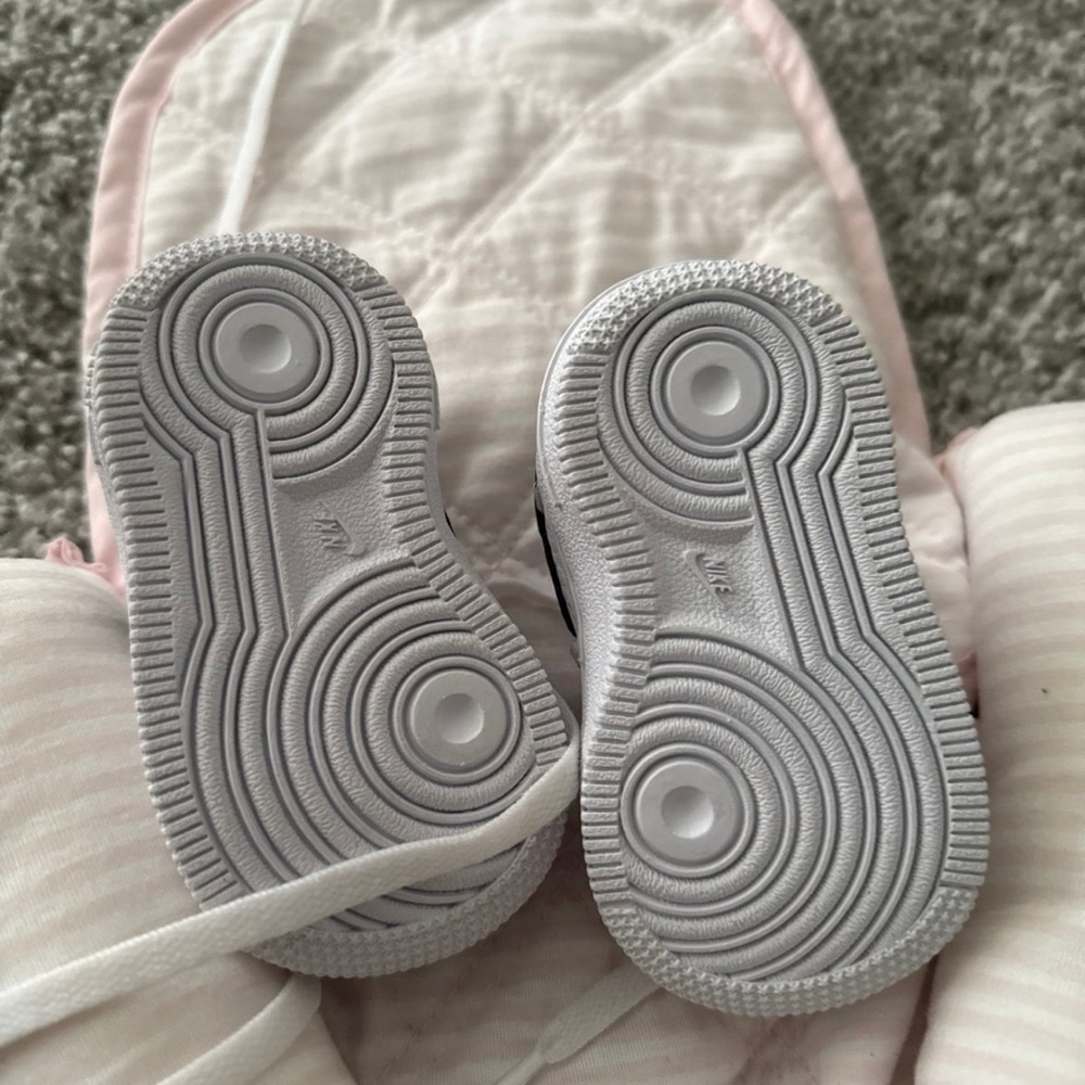 Nike White and Black Sneakers with Iconic Traction Pattern